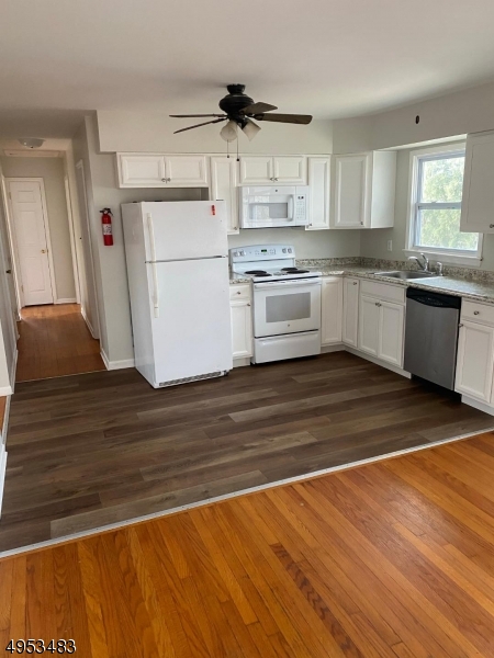 1 Kings Road Netcong, NJ 07857 - Photo 2 of 8 a kitchen with wooden floors and white appliances