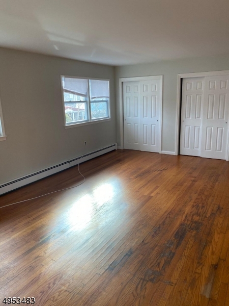 1 Kings Road Netcong, NJ 07857 - Photo 6 of 8 a view of an empty room with wooden floor and a window