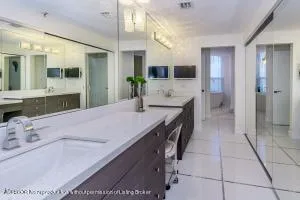 a bathroom with a bathtub and shower