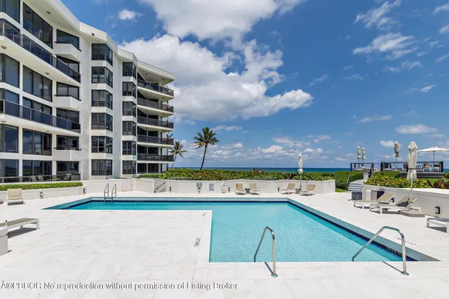 a view of a patio with couches chairs and a yard