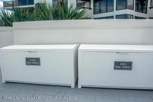 a view of a building with a garden and trees