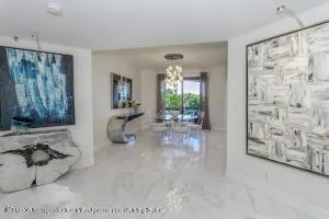 a view of a living room and chandelier