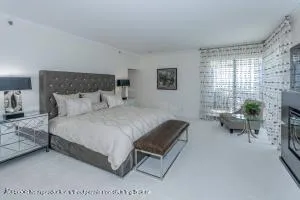 a bedroom with a bed and a couch