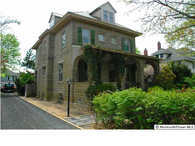 a black and white house with a outdoor space