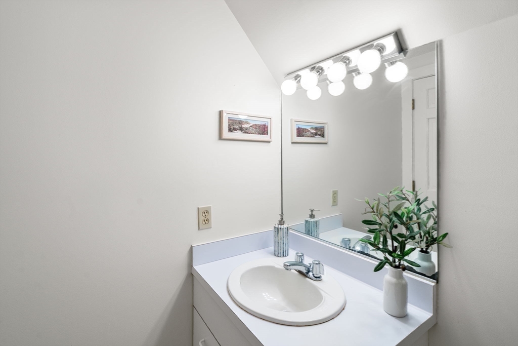 456 Belmont Street, Unit 21 Watertown, MA 02472 - Photo 12 of 19 a bathroom with a sink and a mirror