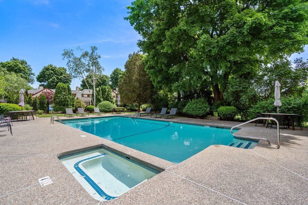 456 Belmont Street, Unit 21 Watertown, MA 02472 - Photo 18 of 19 a view of a swimming pool and a yard