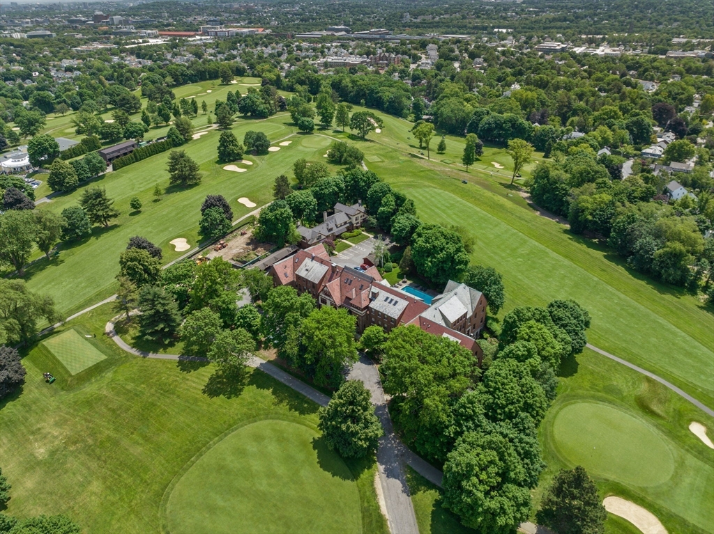 456 Belmont Street, Unit 21 Watertown, MA 02472 - Photo 19 of 19 an aerial view of residential houses with outdoor space and trees