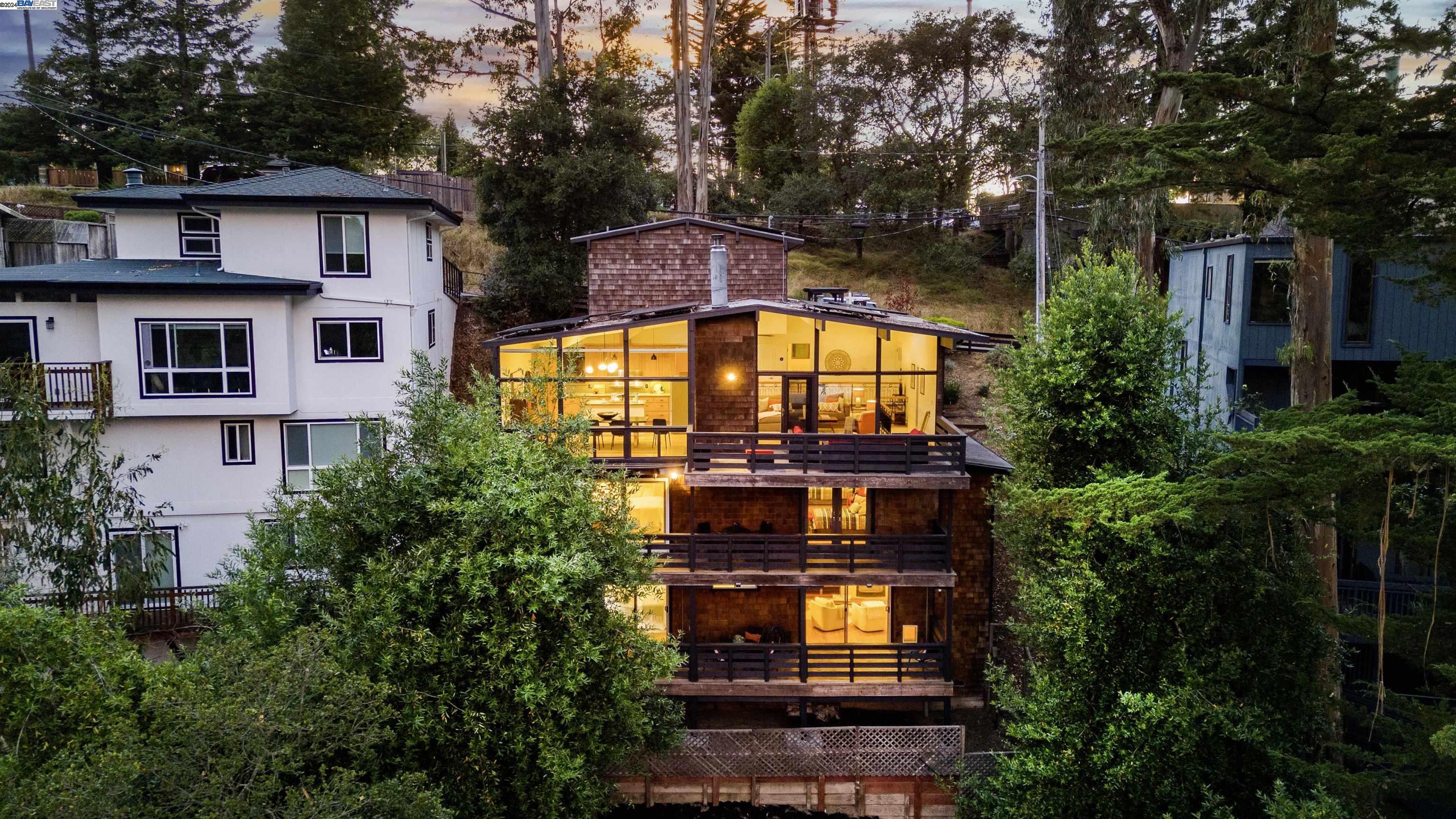 1615 Arrowhead Drive Oakland, CA 94611 - Photo 1 of 1 a view of a big building with a large windows and a yard