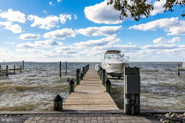 an aerial view of a house with a yard basket ball court and outdoor seating