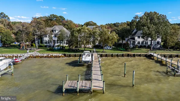 a living room with patio furniture and a flat screen tv
