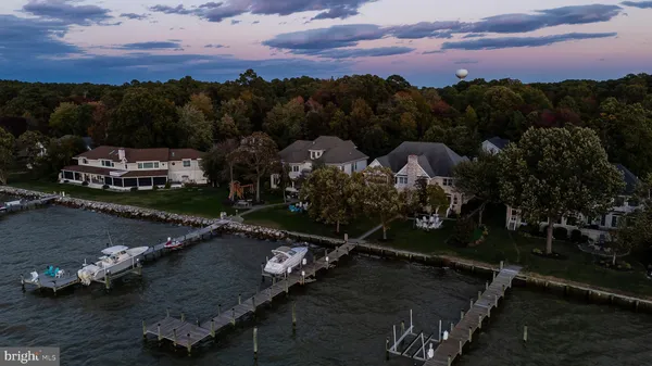 a view of a livingroom with furniture window and wooden floor