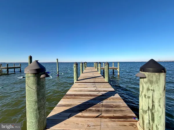 a living room with furniture a window and a flat screen tv
