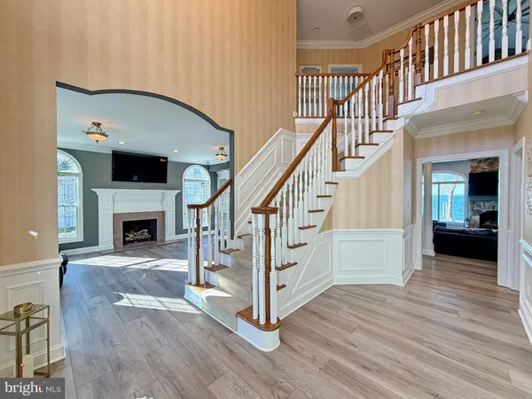a view of balcony with wooden floor and fence