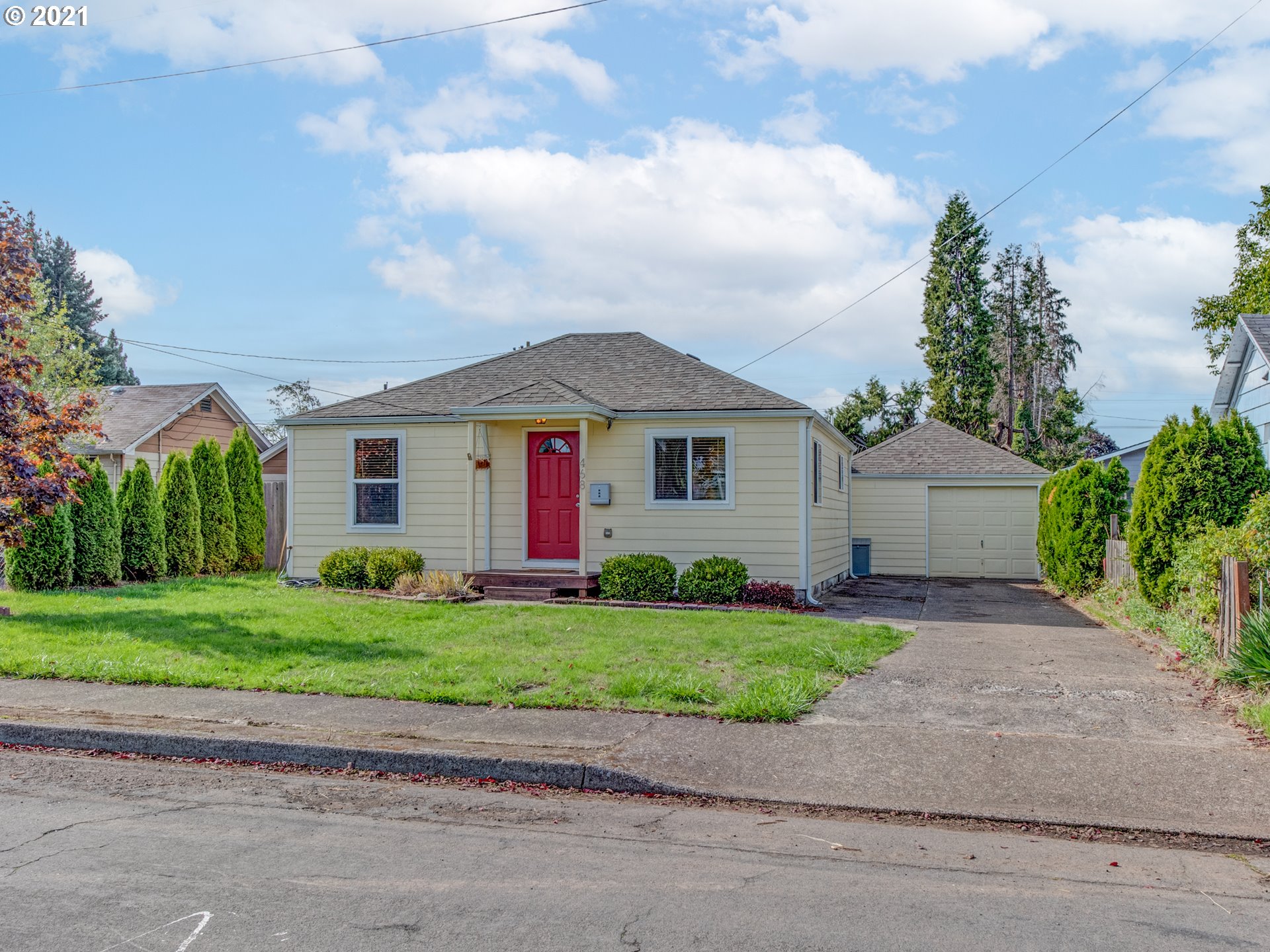 468 17th Street Springfield, OR 97477 - Photo 1 of 21 a front view of a house with a yard and garage