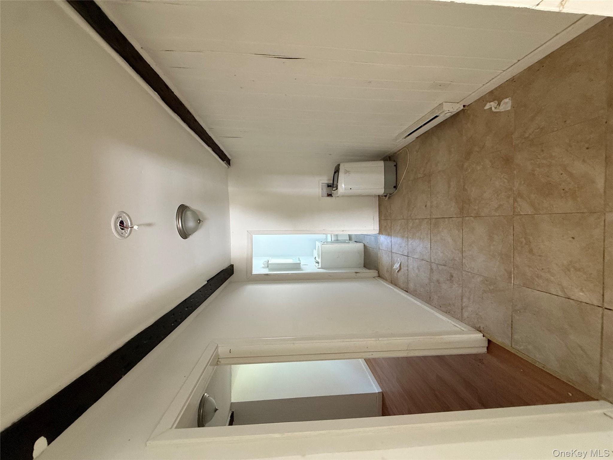 5 Plank Road Mongaup Valley, NY 12762 - Photo 19 of 30 a view of a livingroom with an empty space and a hallway