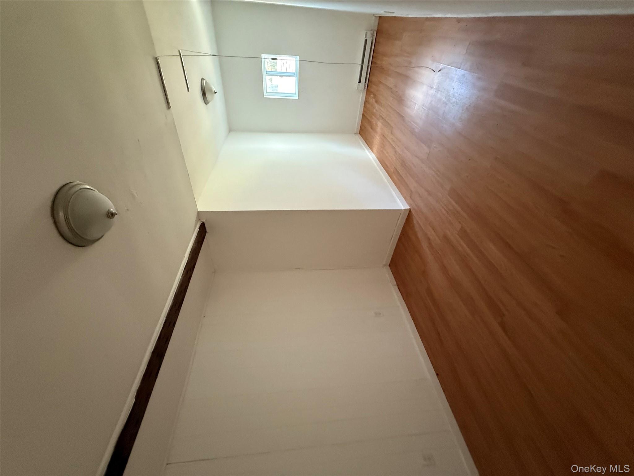 5 Plank Road Mongaup Valley, NY 12762 - Photo 21 of 30 an empty room with wooden floor and windows