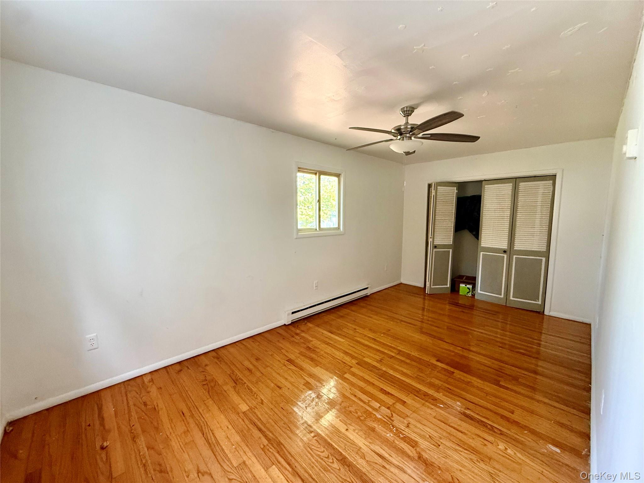 5 Plank Road Mongaup Valley, NY 12762 - Photo 26 of 30 wooden floor in an empty room with a window