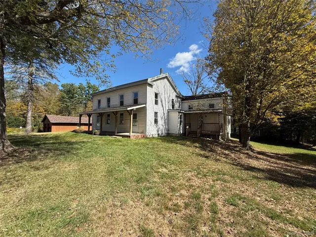 a view of a house with a back yard