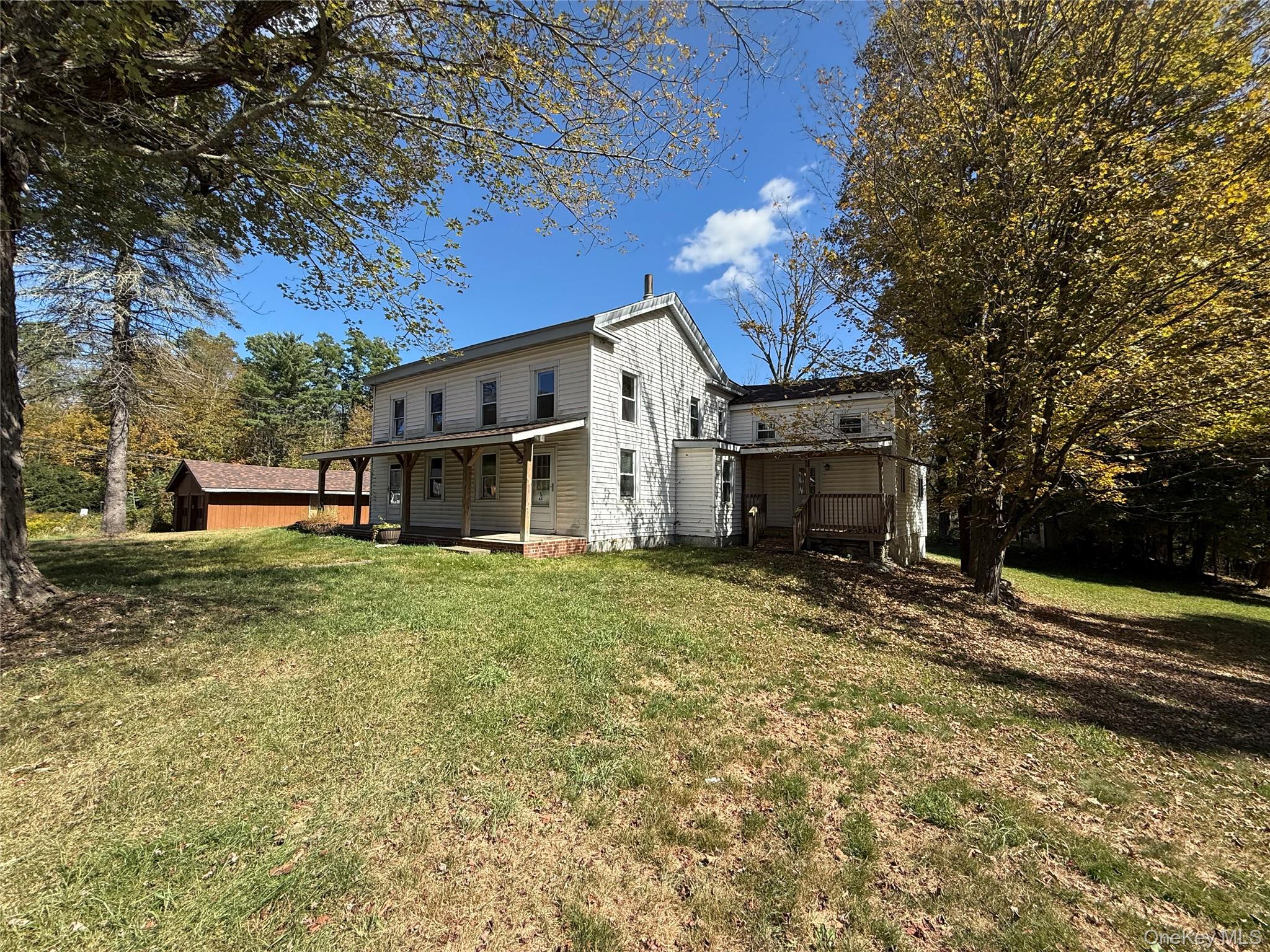 5 Plank Road Mongaup Valley, NY 12762 - Photo 5 of 30 a view of a house with a back yard