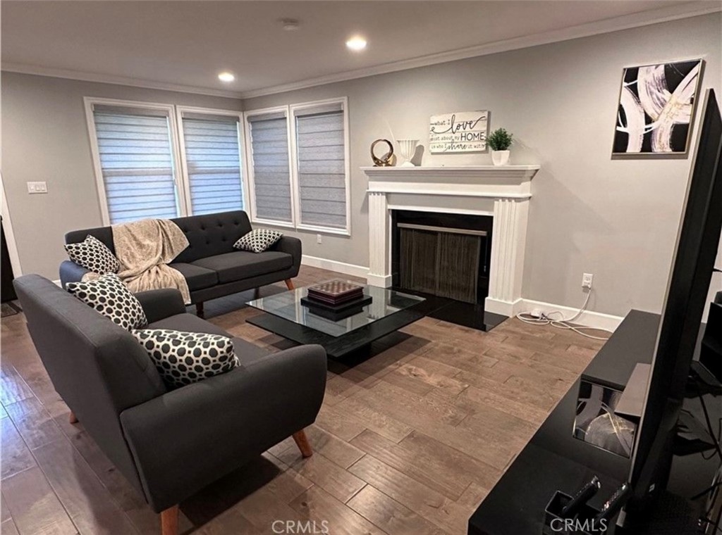 412 Magellan Road Arcadia, CA 91007 - Photo 2 of 15 a living room with furniture and a fireplace