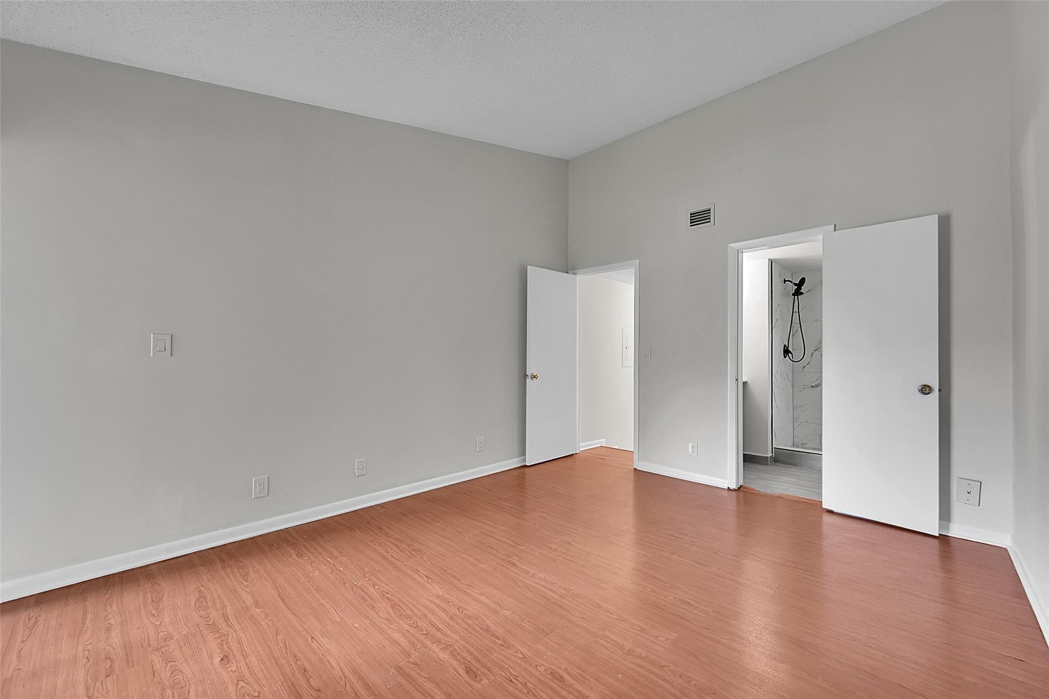 2578 Riverside Drive, Unit 421 Coral Springs, FL 33065 - Photo 15 of 29 wooden floor in an empty room