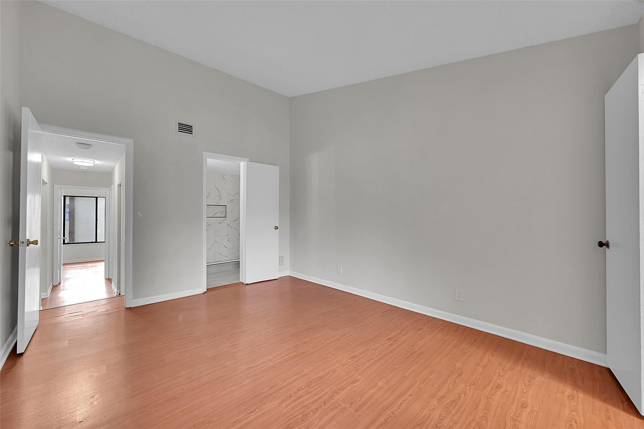 2578 Riverside Drive, Unit 421 Coral Springs, FL 33065 - Photo 16 of 29 a view of an empty room with wooden floor
