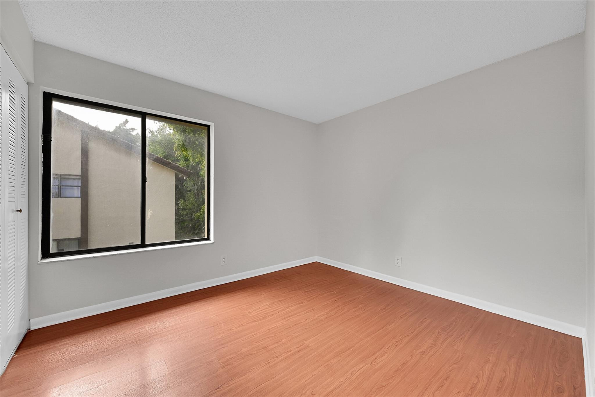 2578 Riverside Drive, Unit 421 Coral Springs, FL 33065 - Photo 18 of 29 an empty room with a window