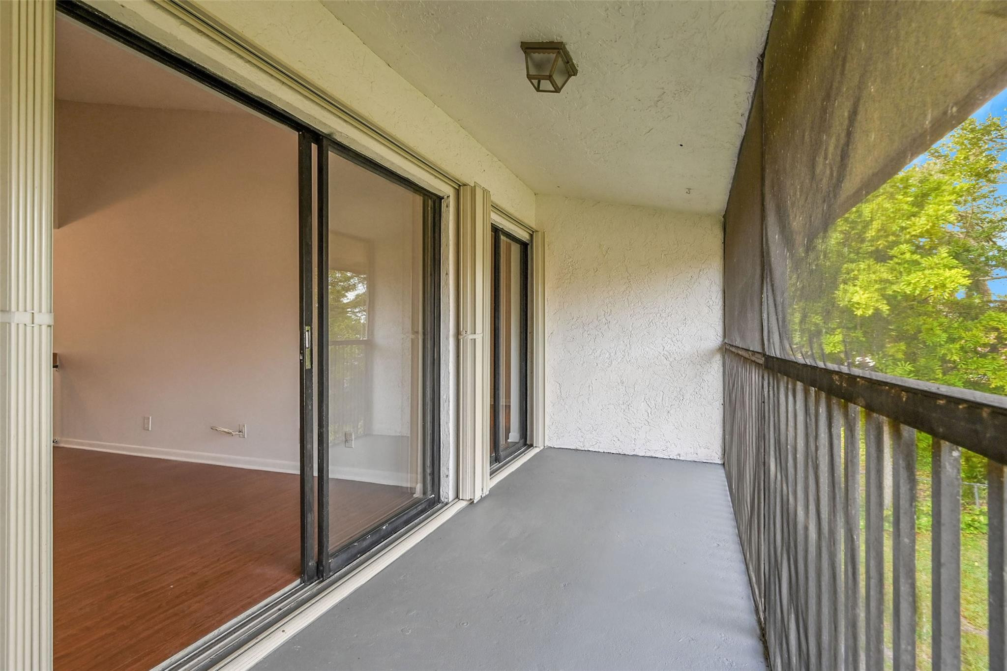 2578 Riverside Drive, Unit 421 Coral Springs, FL 33065 - Photo 24 of 29 a view of a porch with wooden floor