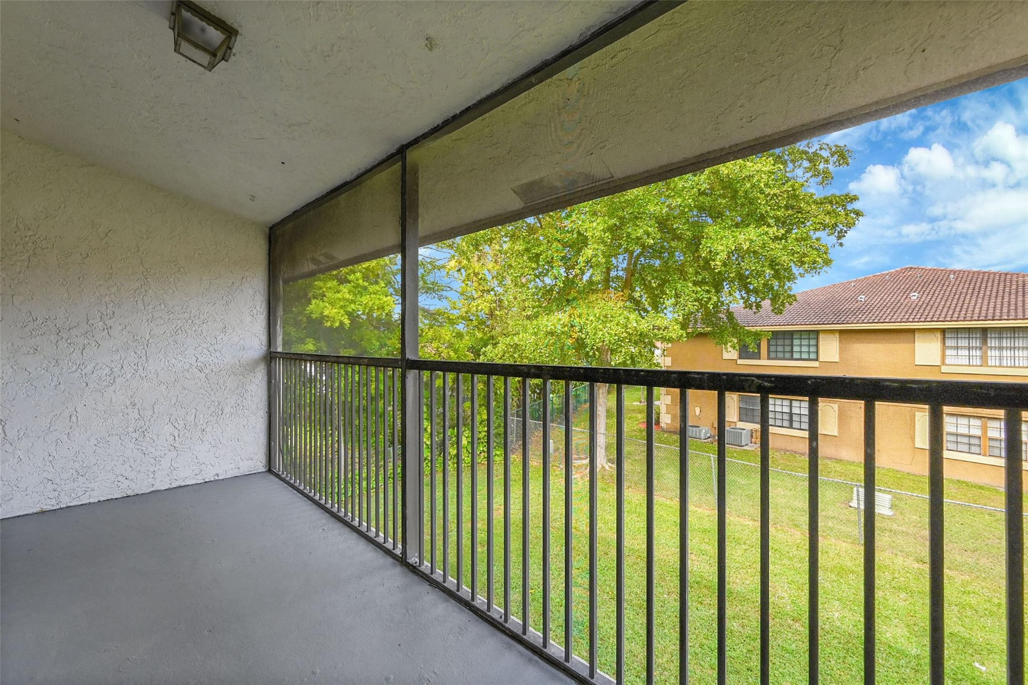 2578 Riverside Drive, Unit 421 Coral Springs, FL 33065 - Photo 25 of 29 a view of balcony with yard
