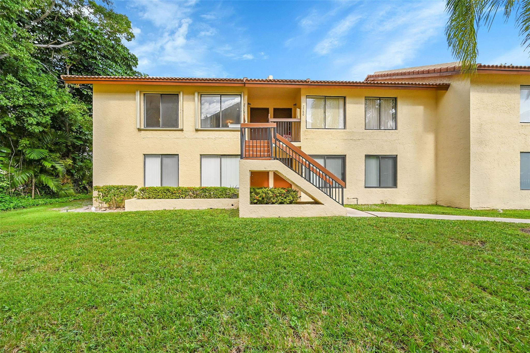 2578 Riverside Drive, Unit 421 Coral Springs, FL 33065 - Photo 26 of 29 a view of a house with a backyard