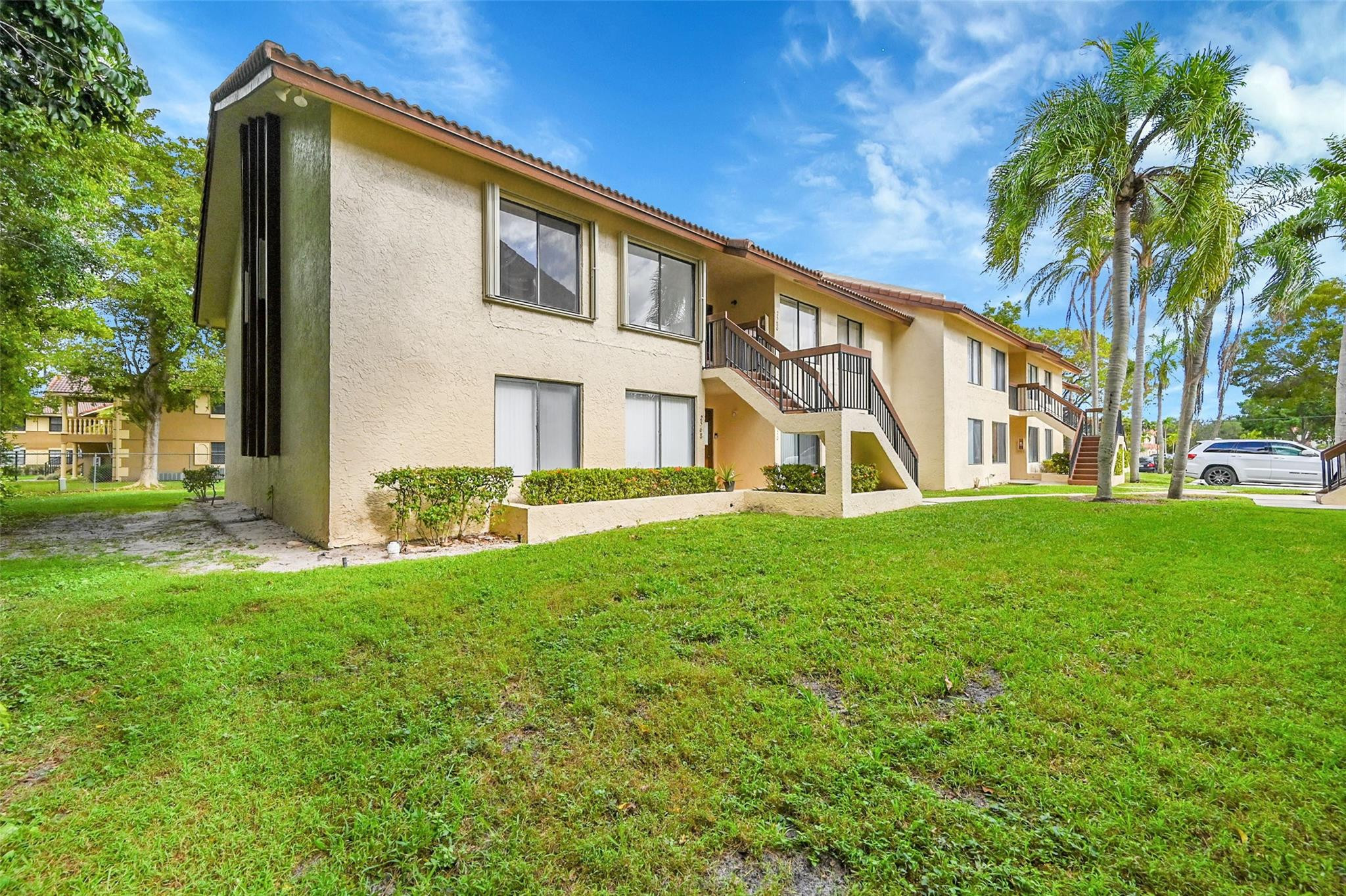 2578 Riverside Drive, Unit 421 Coral Springs, FL 33065 - Photo 27 of 29 a view of a house with a yard