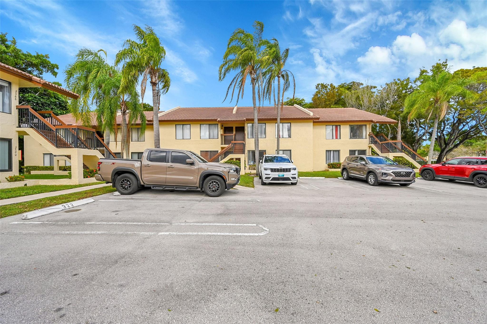 2578 Riverside Drive, Unit 421 Coral Springs, FL 33065 - Photo 29 of 29 a car parked in front of a house