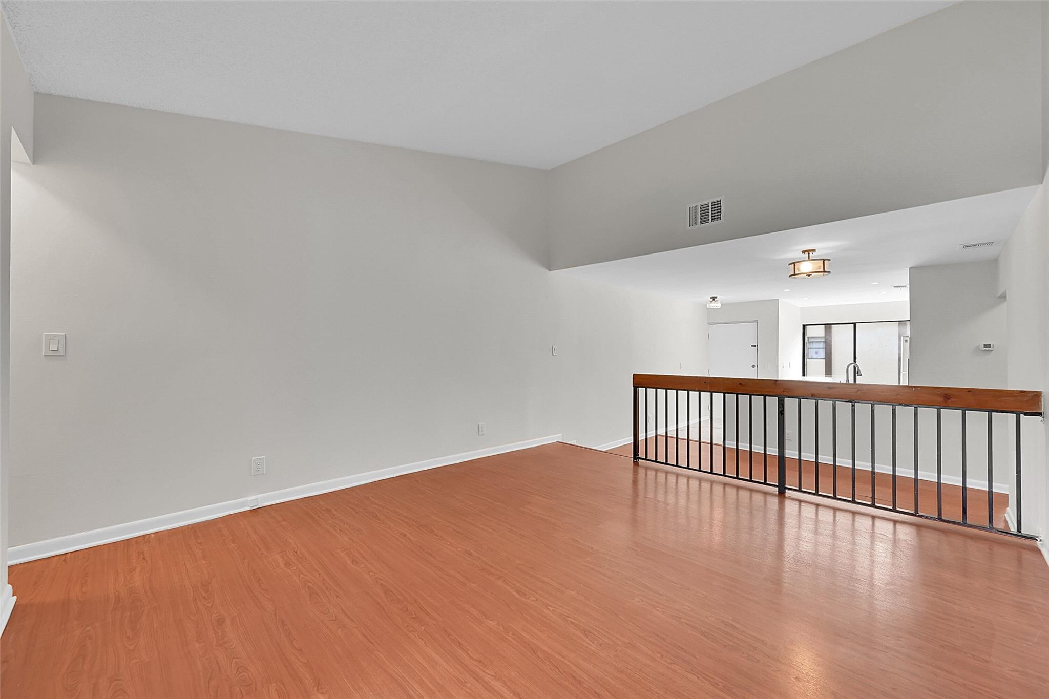 2578 Riverside Drive, Unit 421 Coral Springs, FL 33065 - Photo 9 of 29 a view of a hallway with wooden floor