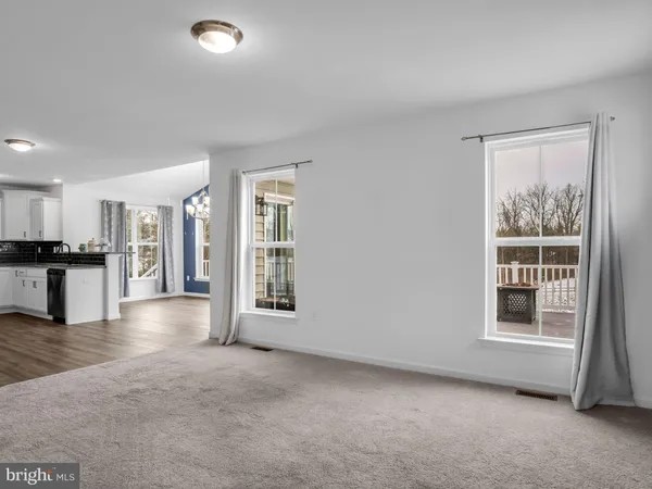 a kitchen with stainless steel appliances a refrigerator a stove a sink dishwasher and a oven with wooden floor