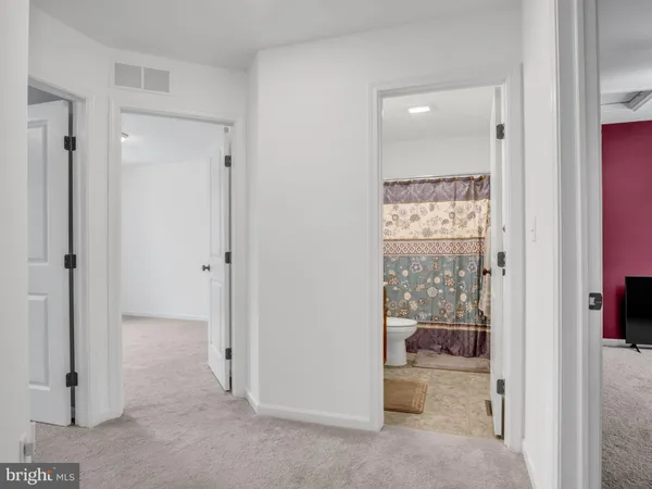 a view of room with window and ceiling fan
