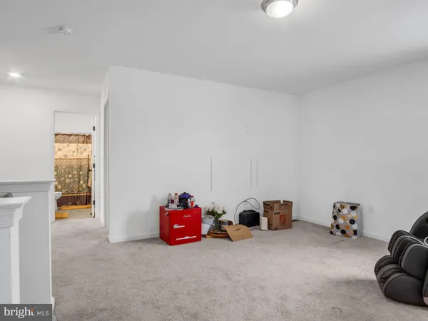 a view of a livingroom with a chandelier fan