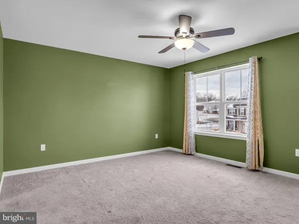 a view of a backyard with table and chairs