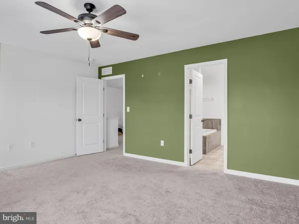 a bathroom with a double vanity sink toilet and a mirror