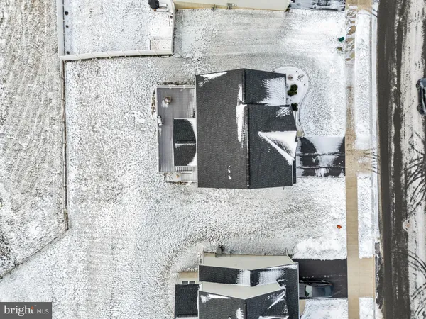 a view of a white house with a yard