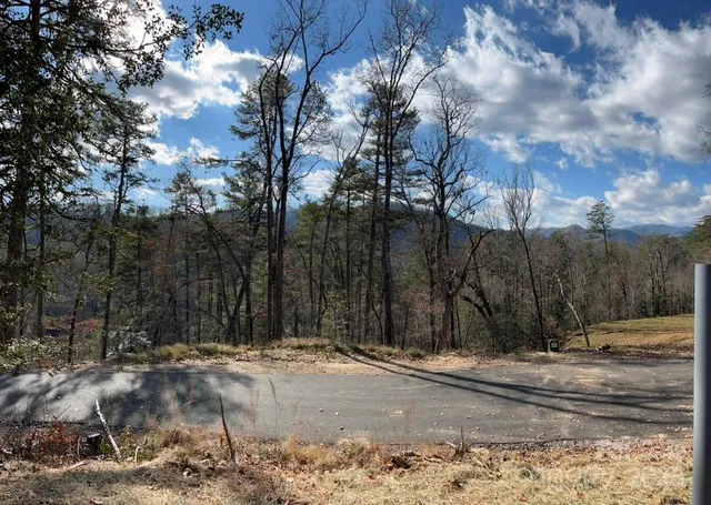 a view of a barn with a big yard