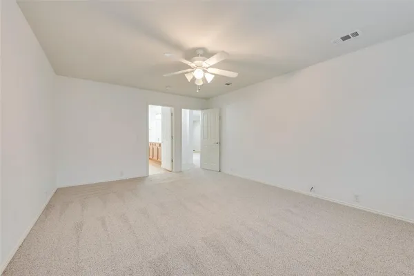a spacious bathroom with a double vanity sink mirror and shower
