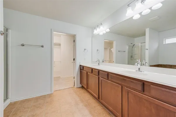 a bathroom with a shower and a sink