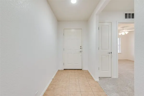 a view of a livingroom with a kitchen