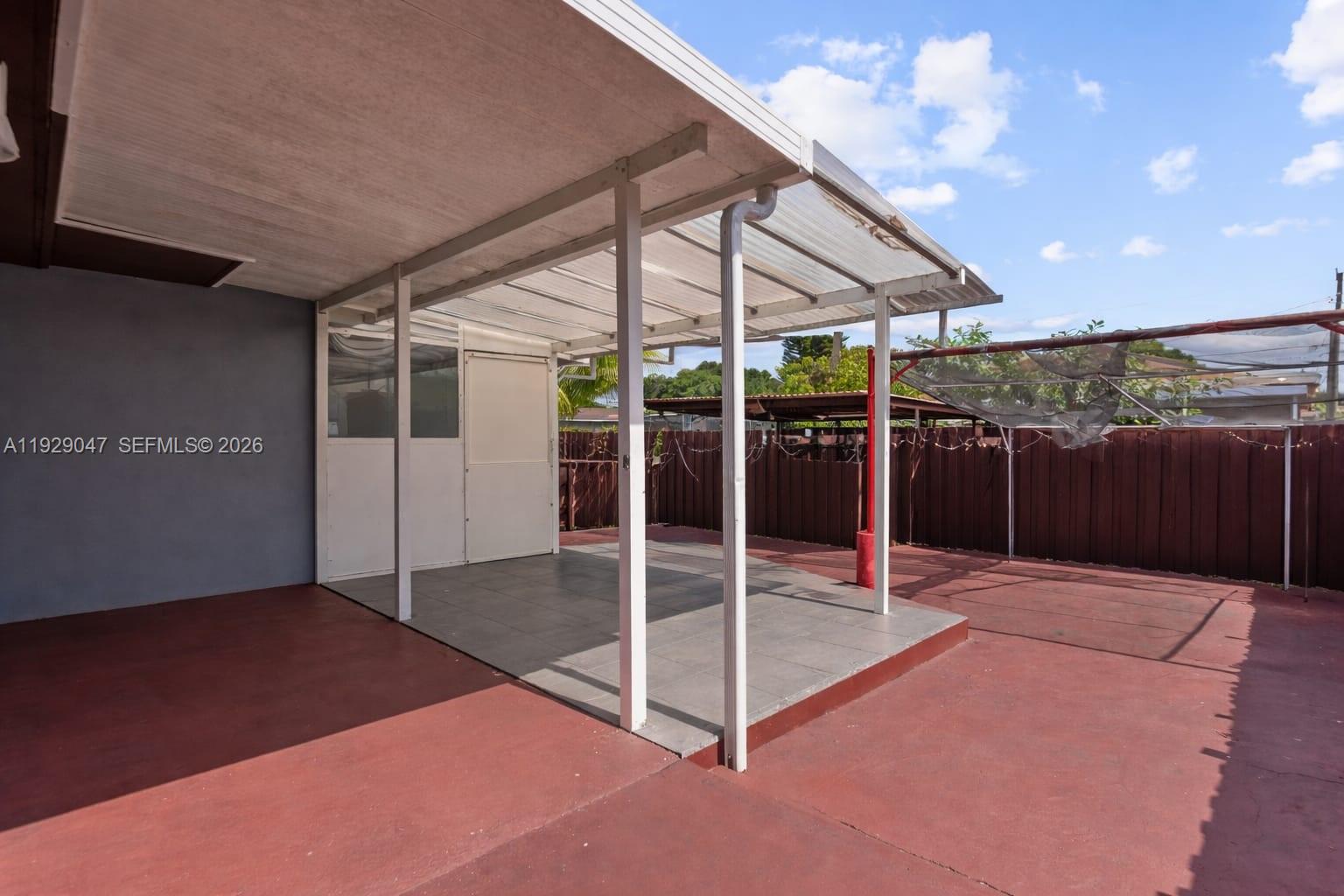 3109 Northwest 64th Street Miami, FL 33147 - Photo 12 of 20 a backyard with table and chairs