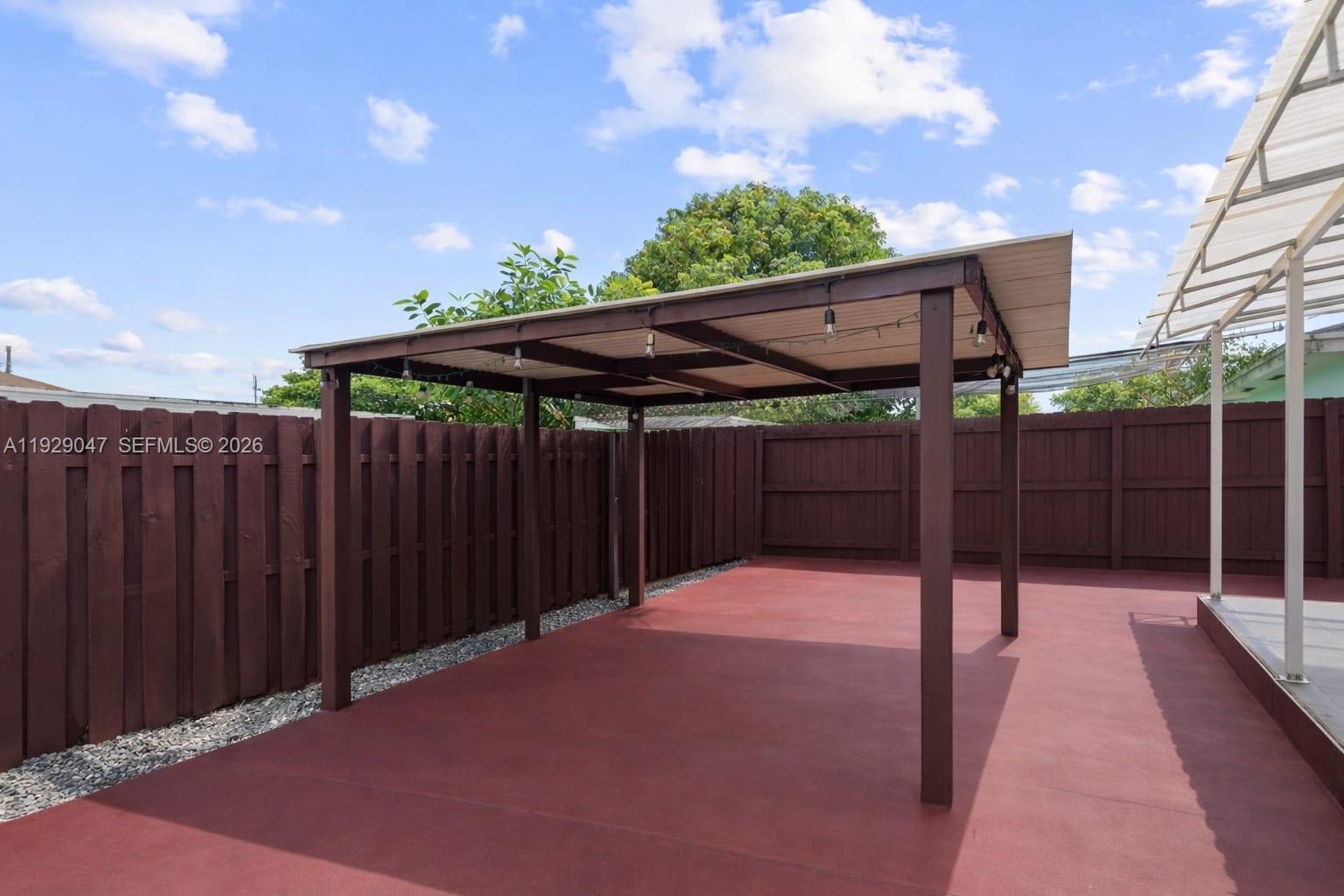 3109 Northwest 64th Street Miami, FL 33147 - Photo 15 of 20 a view of backyard with wooden fence