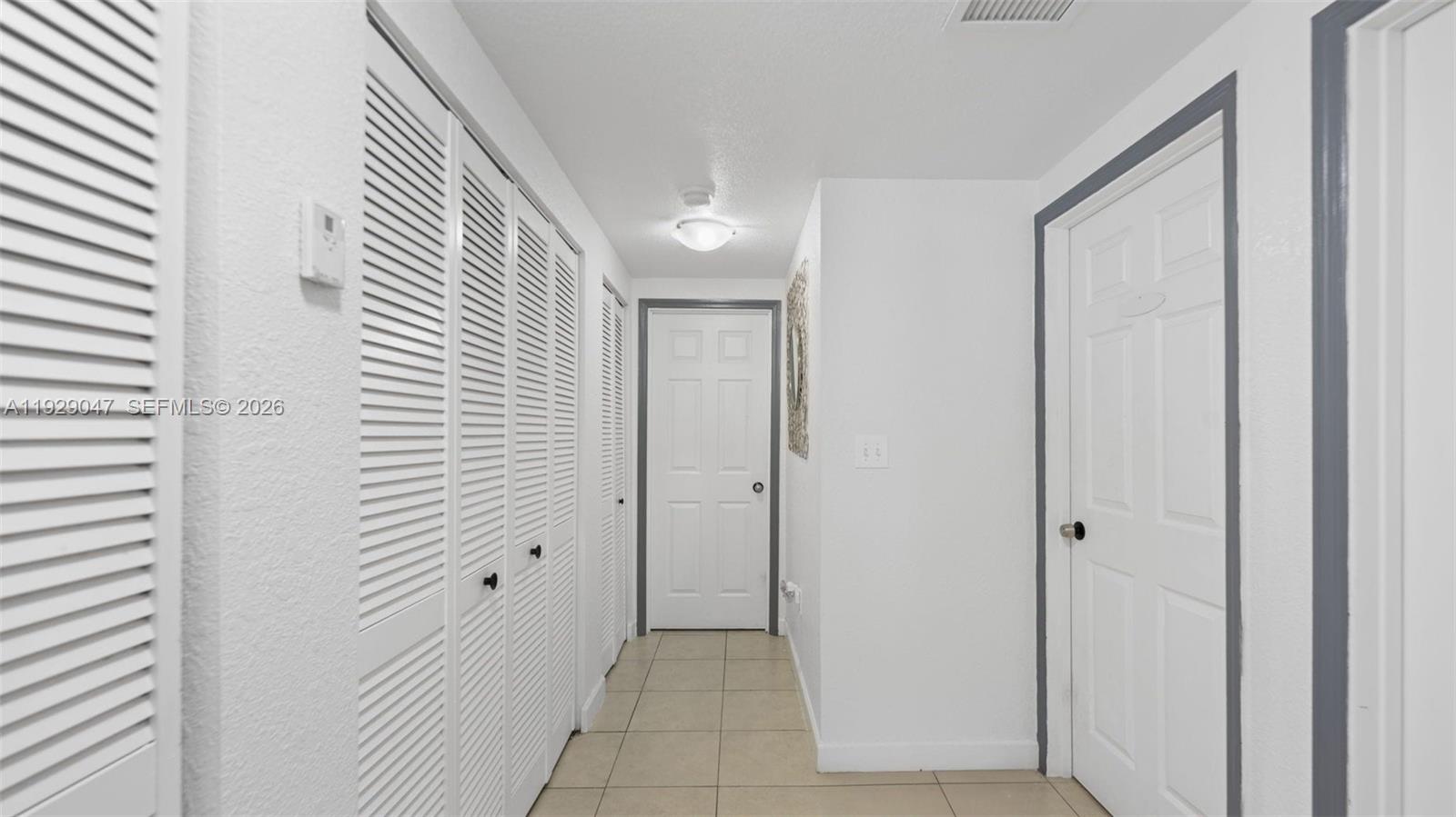 3109 Northwest 64th Street Miami, FL 33147 - Photo 17 of 20 a view of a hallway with a door