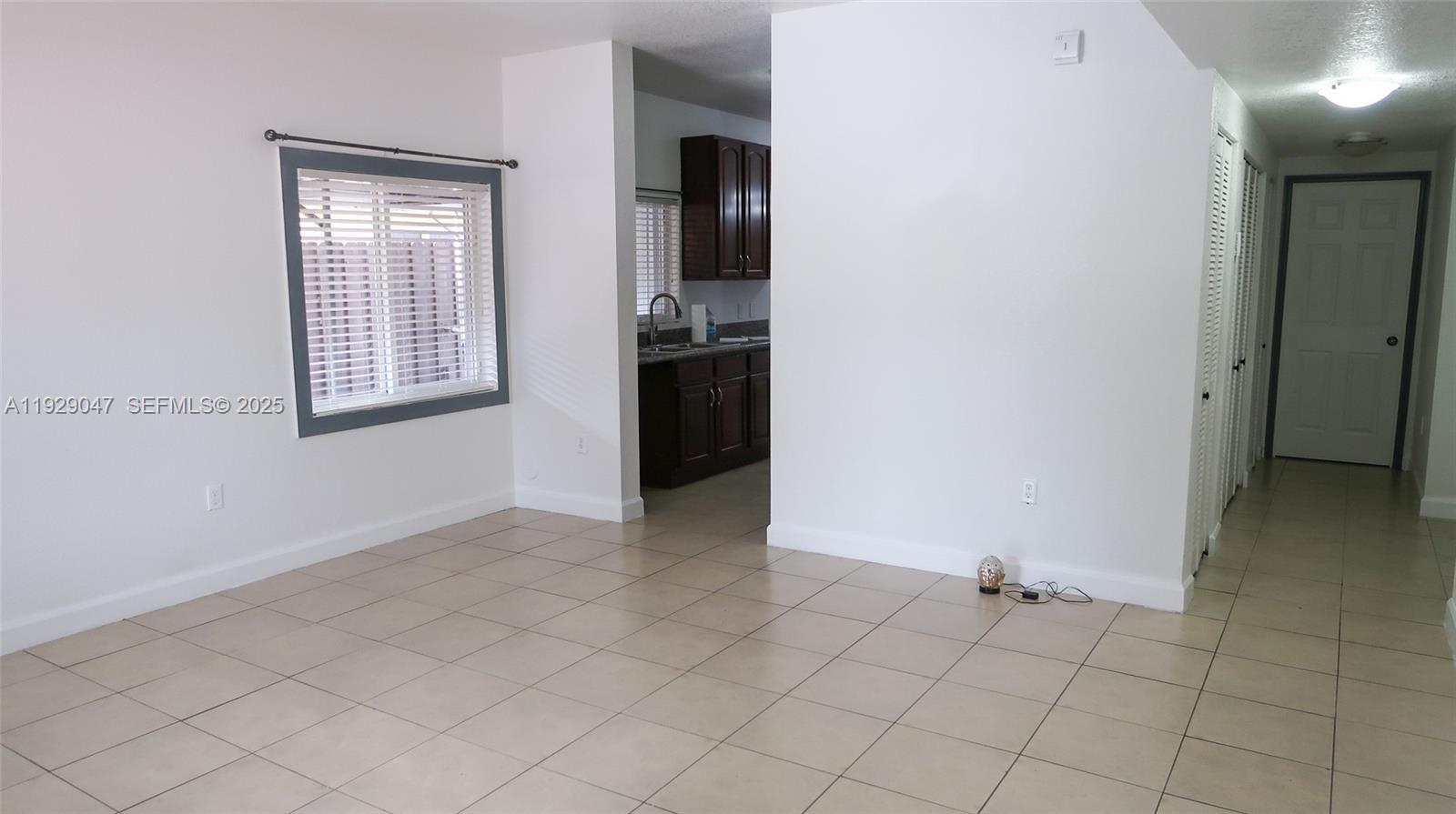 3109 Northwest 64th Street Miami, FL 33147 - Photo 18 of 38 an empty room with closet and windows