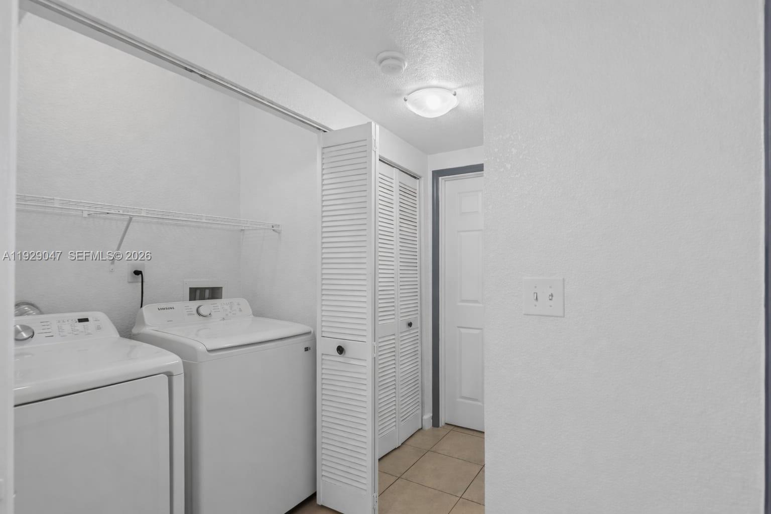 3109 Northwest 64th Street Miami, FL 33147 - Photo 19 of 20 a utility room with dryer and washer