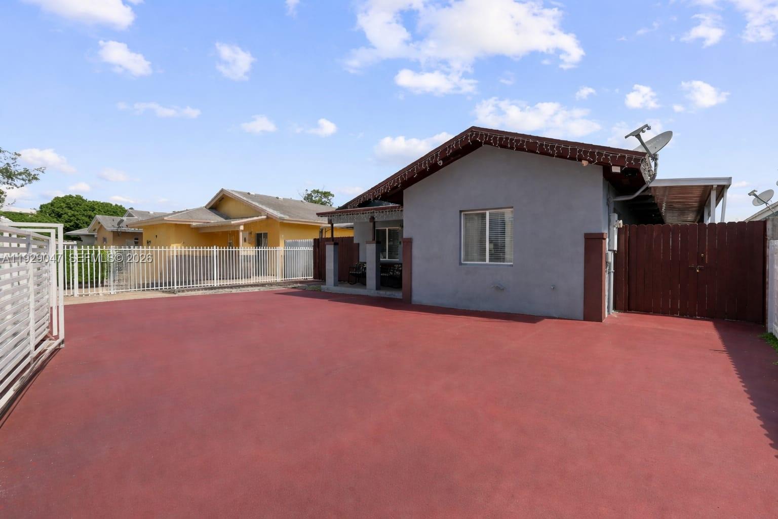 3109 Northwest 64th Street Miami, FL 33147 - Photo 2 of 20 a house with yard in front of it