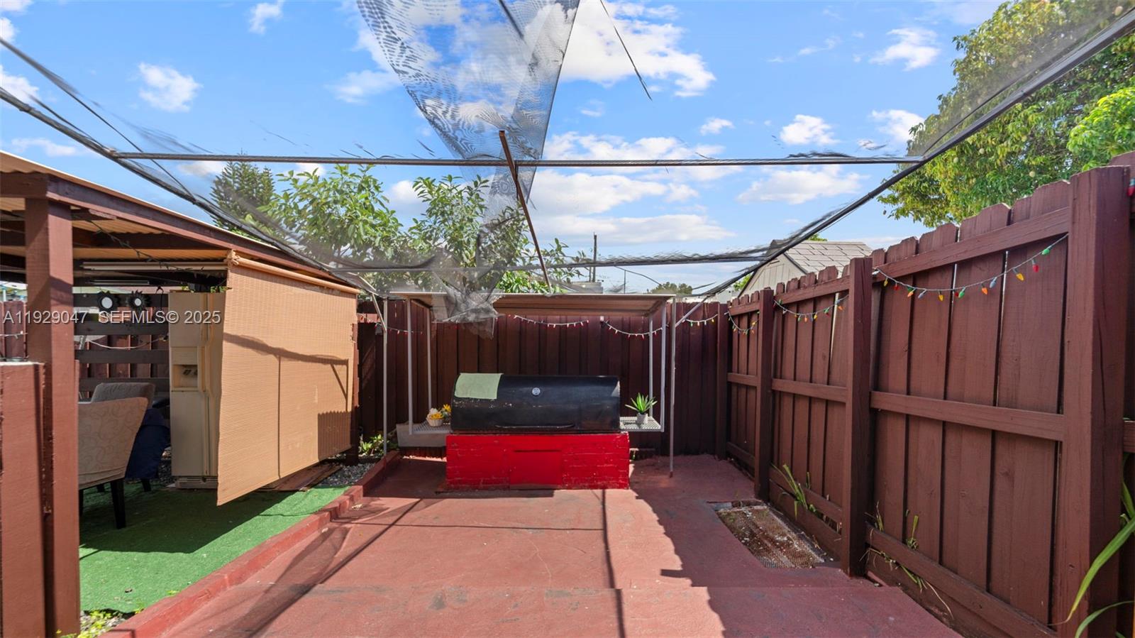 3109 Northwest 64th Street Miami, FL 33147 - Photo 24 of 38 a view of a backyard with glass windows and plants